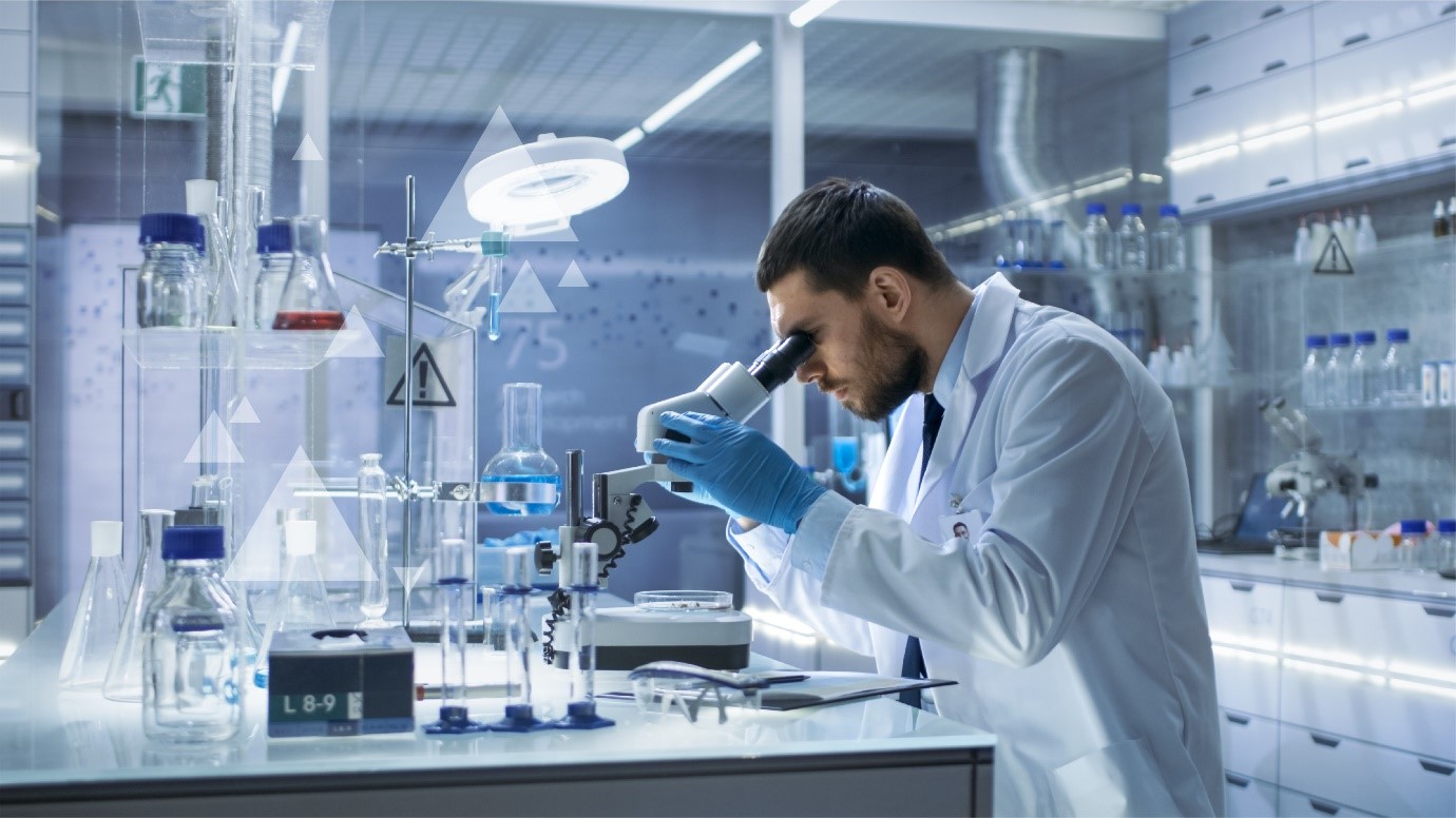 Scientist looking into a microscope 