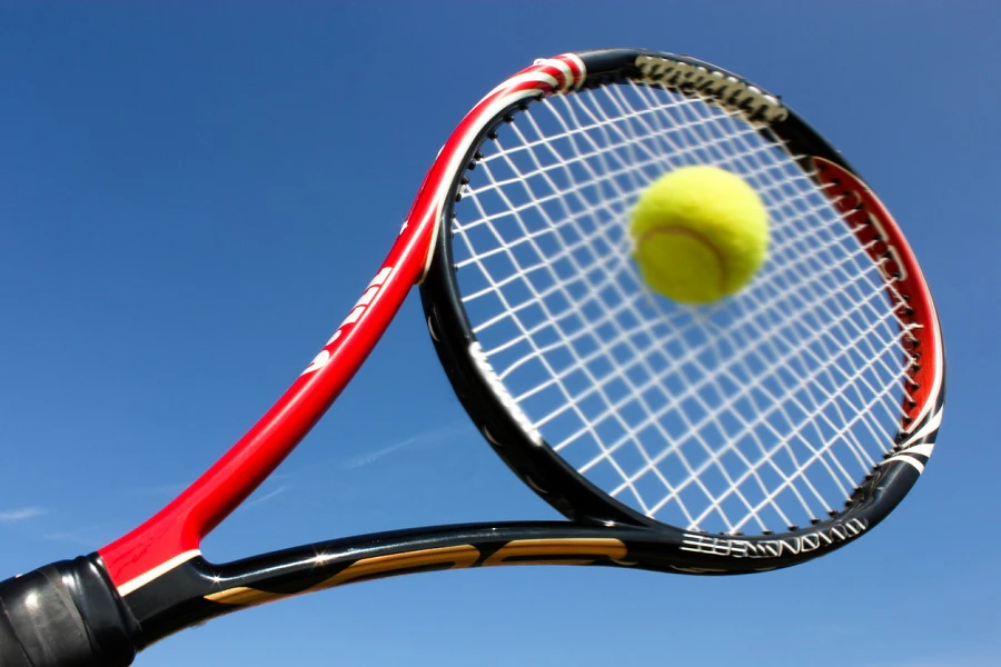 Tennis racket strung with ZYEXTM performance fiber
